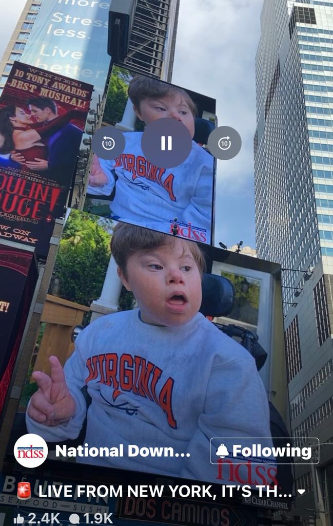 Screenshot of Alex in Times Square featured on the National Down Syndrome Society Facebook page